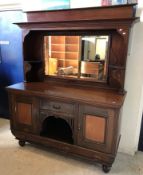 An Edwardian mahogany mirror back sideboard with drawer and two cupboard doors over two further