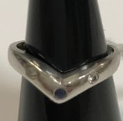 A platinum diamond and sapphire set dress ring, size M/L with adjusters, total weight approx 4.5