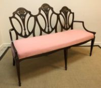 A circa 1900 mahogany and painted three seat salon settee in the Sheraton Revival taste, the