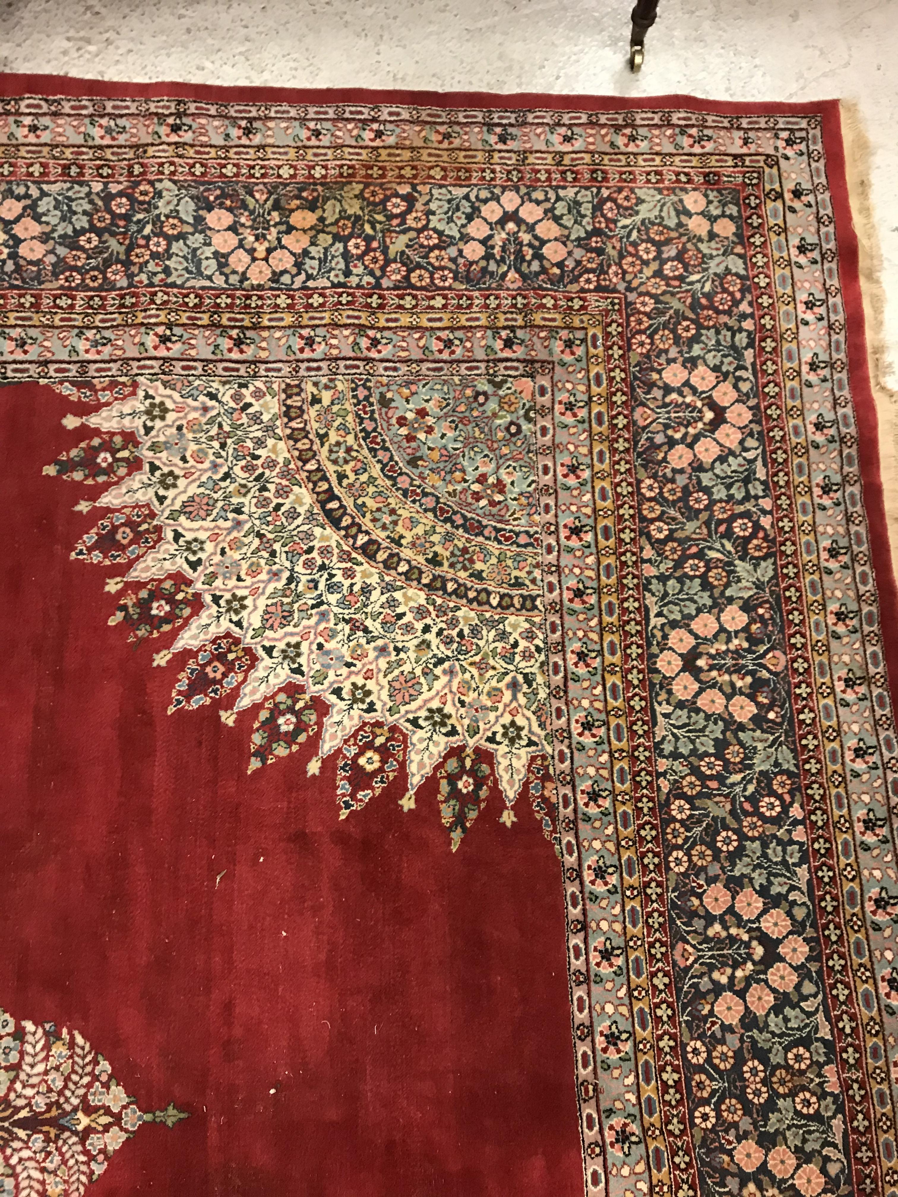 A large fine Oriental carpet, the central panel set with floral decorated circular medallion on a - Image 8 of 12