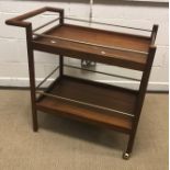 A West Elm teak and white laminated bedside chest of two drawers on splayed supports, 45.6 cm wide x