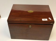 A Victorian mahogany stationery box, the sloping top opening to reveal a fitted interior over two