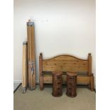 A modern pitch pine double bedstead with plain panelled ends on turned feet, 151 cm wide, together
