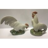 A pair of Royal Copehagen figures of cockerels "Cockerel head up" and "Cockerel head down", 10.5