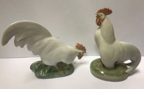 A pair of Royal Copehagen figures of cockerels "Cockerel head up" and "Cockerel head down", 10.5