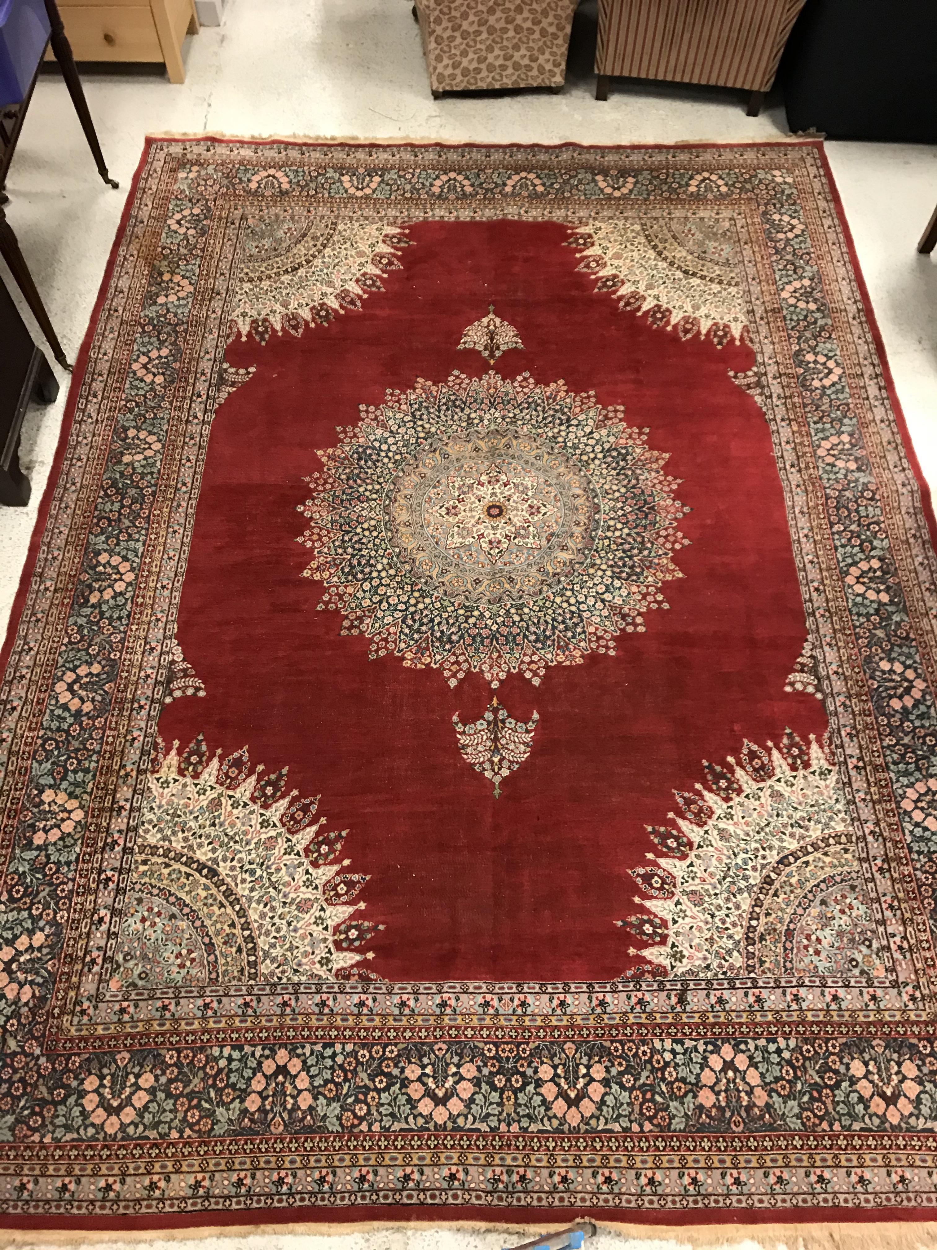 A large fine Oriental carpet, the central panel set with floral decorated circular medallion on a - Image 2 of 12