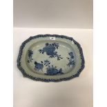 An 18th Century Chinese blue and white shaped rectangular platter with floral spray decoration to