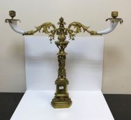 A 19th Century brass table centre of Classical form, the milk glass cornucopia candle holders with