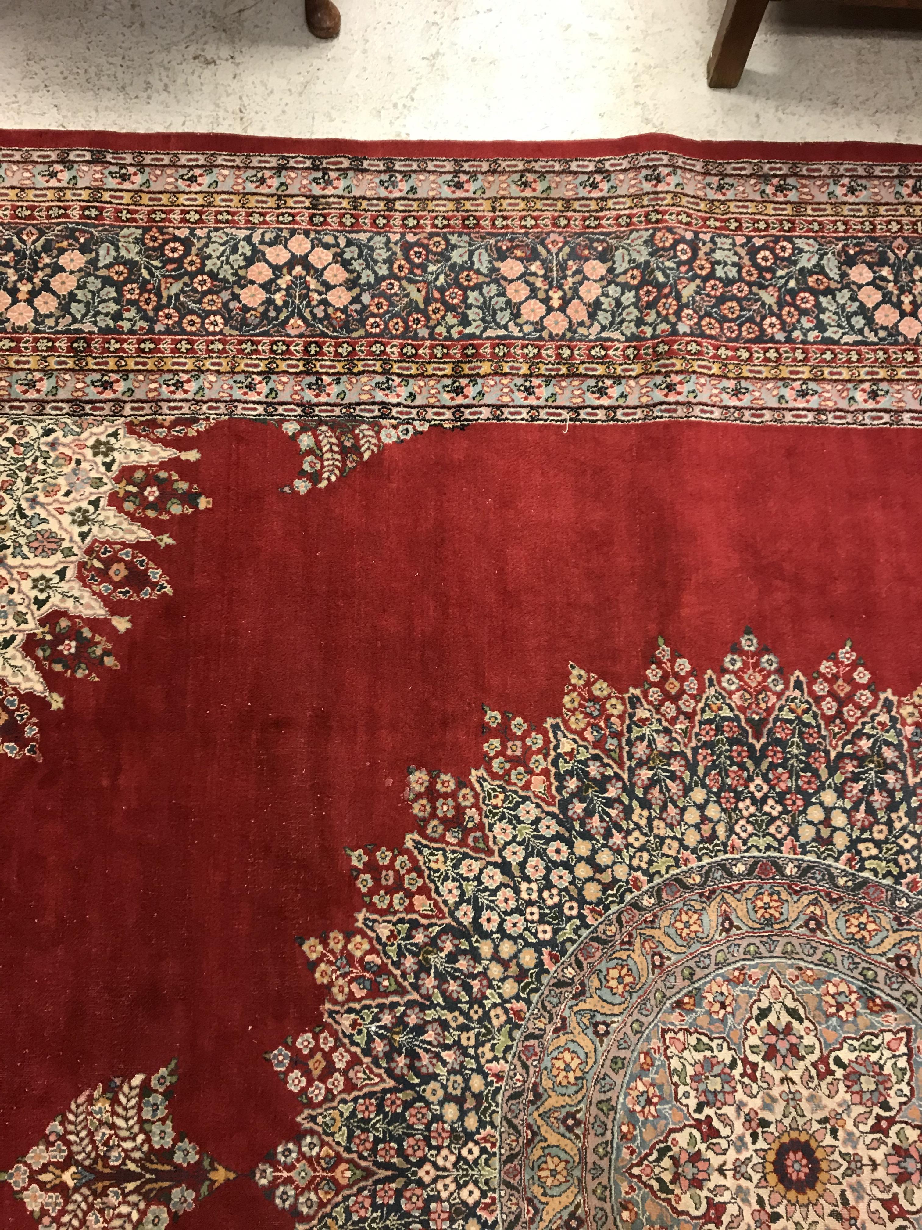 A large fine Oriental carpet, the central panel set with floral decorated circular medallion on a - Image 10 of 12