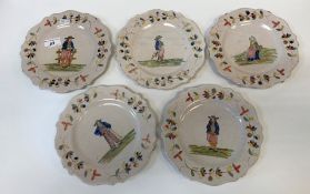 A set of five Quimper pottery tin glazed plates with figural decoration, together with a matching