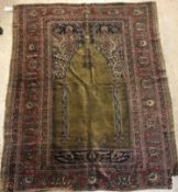 A late 19th Century Ghiordis, West Anatolia silk prayer rug with Mirhab design on a green ground,