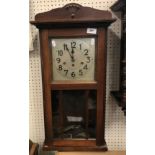 A 1930s mahogany cased drop dial wall clock with musical movement 73 cm high