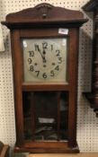 A 1930s mahogany cased drop dial wall clock with musical movement 73 cm high