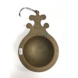 A 19th Century Chinese bronze censer / bowl with single shaped lug handle, raised on a circular