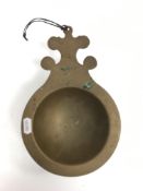 A 19th Century Chinese bronze censer / bowl with single shaped lug handle, raised on a circular