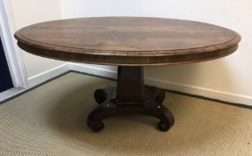 A Victorian rosewood centre table, the oval top with moulded edge above a plain frieze on tapering