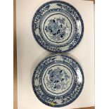 A pair of 19th Century Chinese blue and white chargers, the centre field decorated with vase of