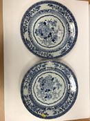 A pair of 19th Century Chinese blue and white chargers, the centre field decorated with vase of