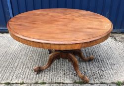 A Victorian mahogany breakfast table, the snap top on a turned and reeded pedestal to moulded