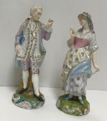 A pair of Derby-style figures of a gentleman and woman in mob cap, damaged and restored to the shell