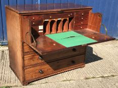 An early 19th Century mahogany and rosewood cross banded secretaire chest, the top with ropework