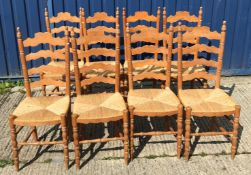 A set of eight modern pine rush seat ladder back dining chairs in the 19th Century manner, 42 cm