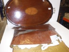An Edwardian mahogany and fan marquetry inlaid two handled drinks' tray of oval form with brass