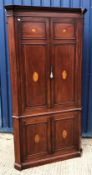 An Edwardian mahogany and inlaid free-standing corner cupboard, the upper doors with fan marquetry
