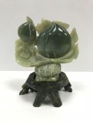 A 20th Century Chinese carved jade group of “Two peaches”, approx 20 cm high overall