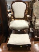 A Victorian moulded walnut framed shaped back salon open arm elbow chair on cabriole front legs to