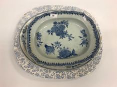 An 18th Century Chinese blue and white shaped rectangular platter with floral spray decoration to