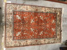 A Tabriz carpet, the central panel set with all-over figural and animal decoration including