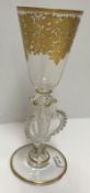 A 19th Century Continental glass goblet with gilded decorated funnel-shaped bowl on an openwork