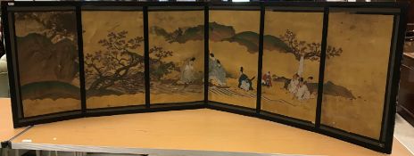 19TH CENTURY JAPANESE SCHOOL – six section table screen depicting “Figures in a landscape with Maple