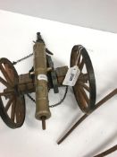 A bronze model working canon, bearing various cyphers including "GR" and "360" over "C", within a