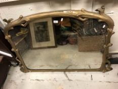 A Victorian gilt framed overmantel mirror of coppiced branch form enclosing a dome top plate, 125 cm