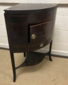 A late George III mahogany corner washstand, the top rising to provide a two section splashback