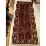 A Persian carpet, the central panel set with repea