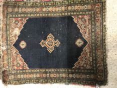 A Shenna rug, the central panel set with three med