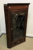 A 19th Century oak and walnut cross-banded hanging