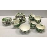 A Coalport green five toed dragon decorated tea se