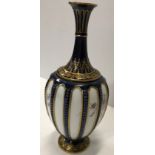 A Royal Worcester blue and gilt decorated stem vas