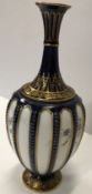A Royal Worcester blue and gilt decorated stem vas