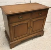 A modern mahogany bookcase cabinet with three glaz