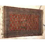 A Bokhara type carpet, the central panel set with