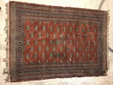 A Bokhara type carpet, the central panel set with