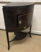 A late George III mahogany corner washstand, the t