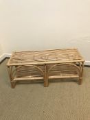 An Oliver Bonas canework two tier occasional table