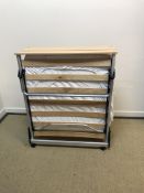 A Jay-Be folding Z bed with beach effect shelf top