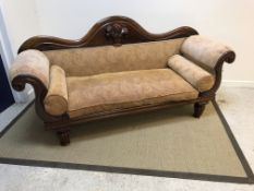 A Victorian mahogany framed scroll arm sofa, the s